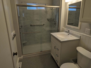 A photo of a well-lit bathroom.