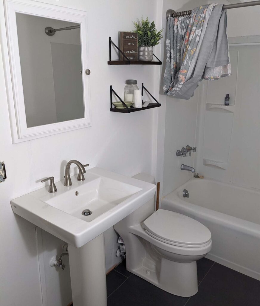 A photo of a well-lit bathroom.