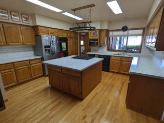 An interior view of a large kitchen.
