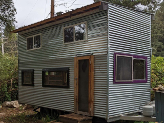 A tiny home with tasteful corrugated metal siding.