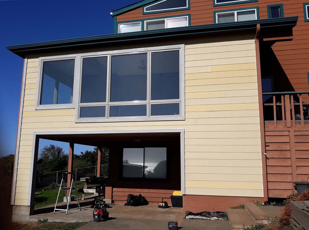 A spacious living space over a carport with newly-installed siding